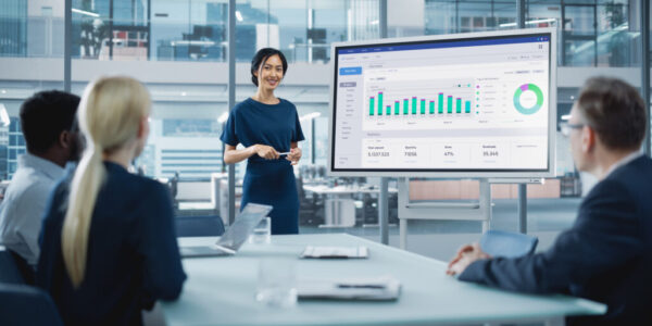 Female Operations Manager Holds Meeting Presentation for a Team